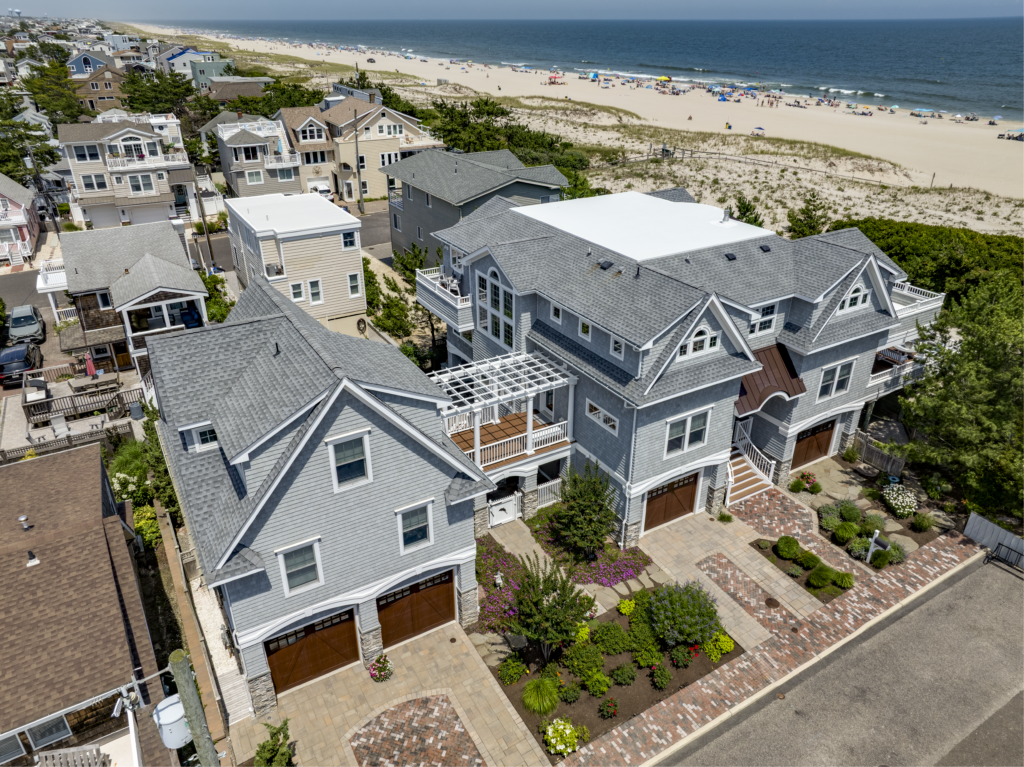 Exterior of a luxury custom home on LBI featuring coastal design, in-law suite, and beautiful landscaping | Stonehenge Built | LBI Custom Home Builder