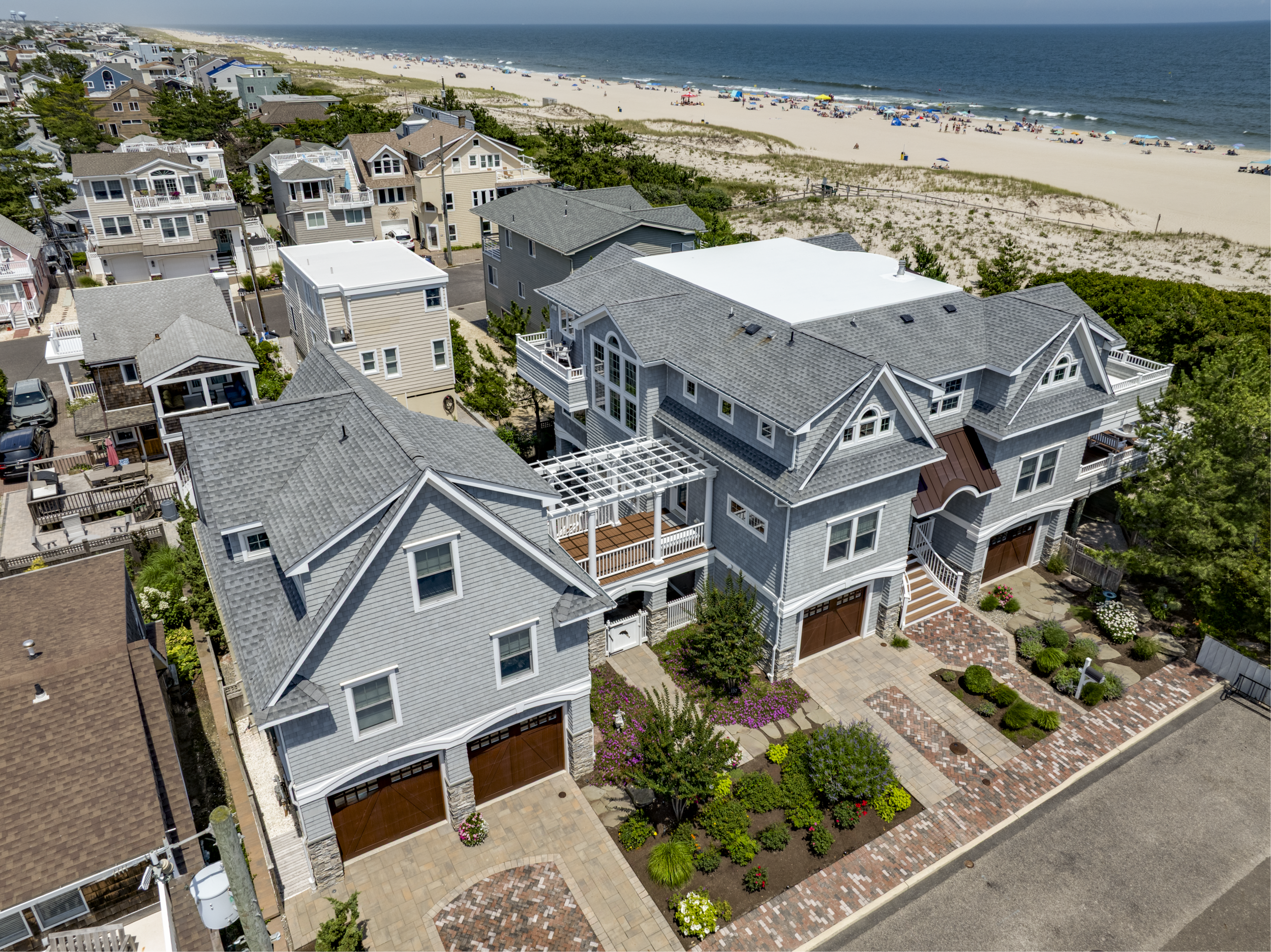 Exterior of a luxury custom home on LBI featuring coastal design, in-law suite, and beautiful landscaping | Stonehenge Built | LBI Custom Home Builder