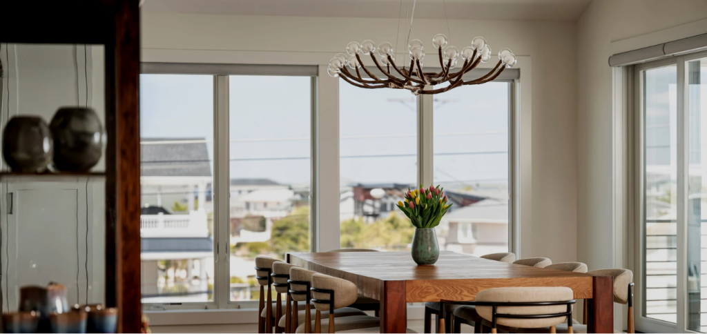 Breakfast nook overlooking LBI in a luxury custom home on LBI with coastal inspired details including decor and color palette with wood floors throughout | Stonehenge Built | LBI custom home | custom home on LBI | Stonehenge Building | Best LBI Custom Home Builder