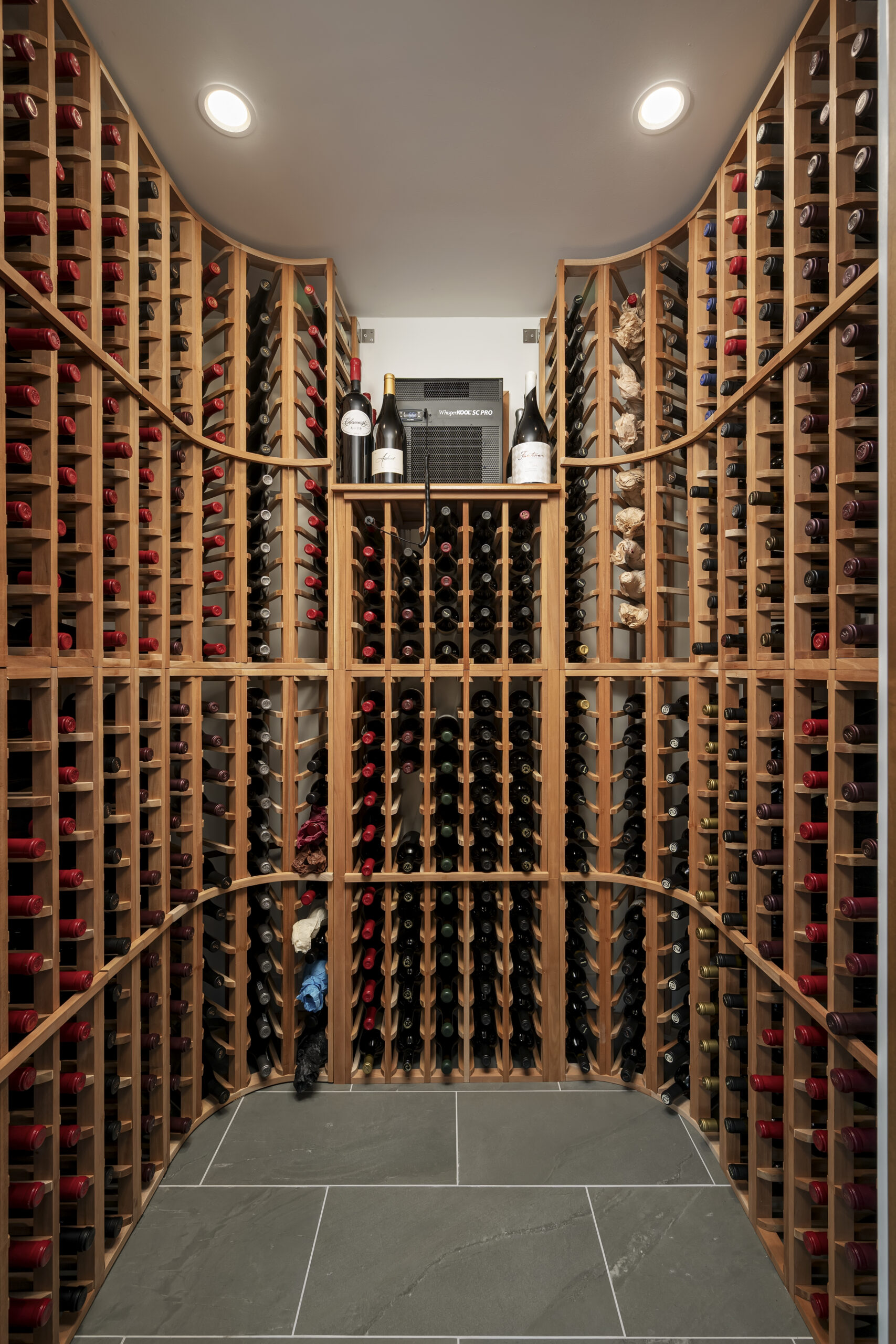 Custom wine cellar inside one of our luxury custom homes on LBI with coastal inspired details including decor and color palette with wood floors throughout | Stonehenge Built | LBI custom home | custom home on LBI | Stonehenge Building | Best LBI Custom Home Builder